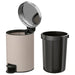 IKEA EKOLN beige waste bin with lid closed, shown in a home setting