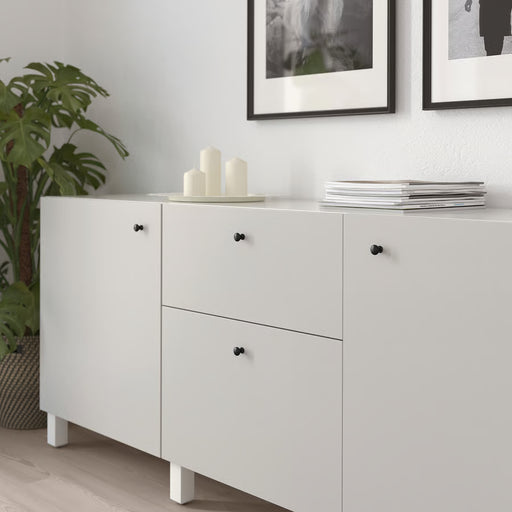 IKEA ENERYDA black knobs on white cabinet styled with candles and magazines