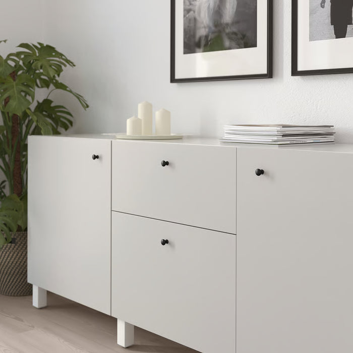 IKEA ENERYDA black knobs on white cabinet styled with candles and magazines