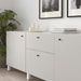 IKEA ENERYDA black knobs on white cabinet styled with candles and magazines