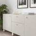 IKEA ENERYDA chrome knobs installed on grey kitchen cabinets modern interior