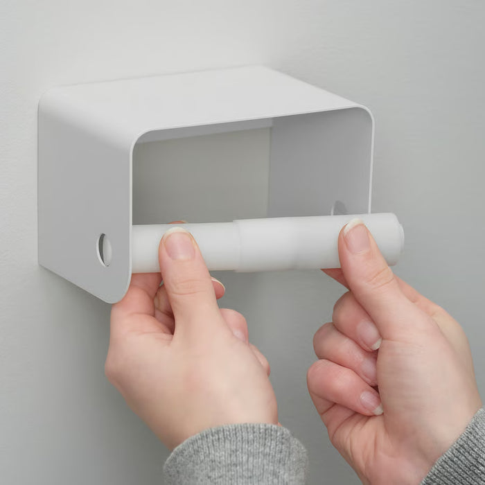 Close-up of IKEA ENUDDEN toilet roll holder spring reel mechanism and shelf top detail