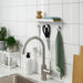 Close-up of IKEA ENUDDEN white powder-coated hooks and shelf edge detail