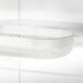 Close-up of a white ceiling light fixture with a mesh design on a white background