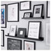 IKEA MOSSLANDA picture ledge in black, 55 cm (21 ¾ inches), holding photo frames and decorations 50297466
