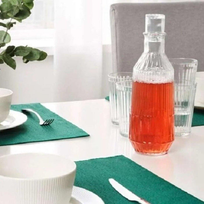 IKEA UTBYTT Place mat, dark green, 35x45 cm with OFTAST Deep plate, light green, 20 cm and Spoon, stainless steel, 20 cm  SILVERARV Napkin, striped light beige/off-white, 35x35 cm