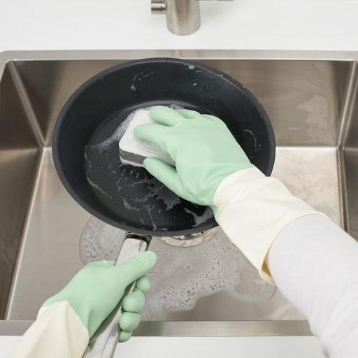  IKEA RINNIG green cleaning gloves worn on hands showing fit and grip