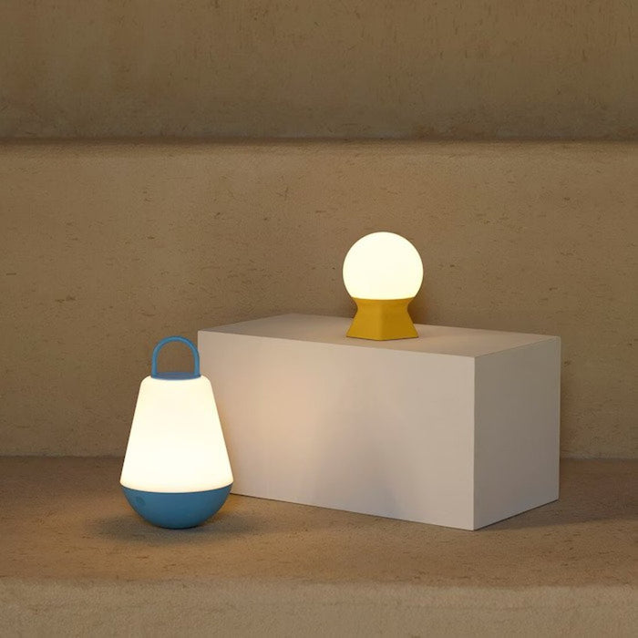 The LED decorative table lamp placed on a desk, providing a cozy ambiance for studying or working.