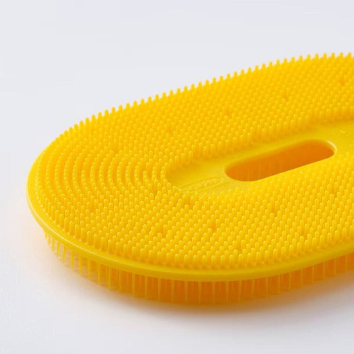 Bright yellow scrubber designed for effortlessly cleaning vegetables by IKEA 40533223