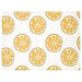 Patterned yellow place mat on a dining table with elegant tableware and utensils.