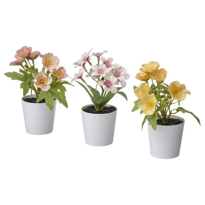 Alt text for the first plant: "Lifelike artificial green plant in a white ceramic pot-20535732
