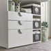 Organized living space with IKEA LEN storage boxes in green and light grey"