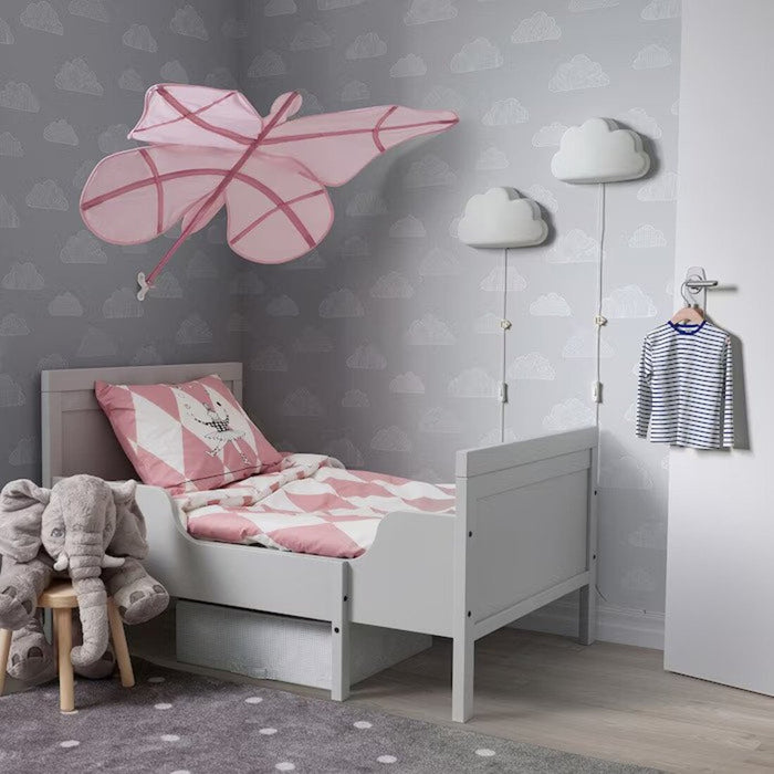 A pink IKEA SNÖFINK Bed Canopy with butterfly accents hanging gracefully from a ceiling