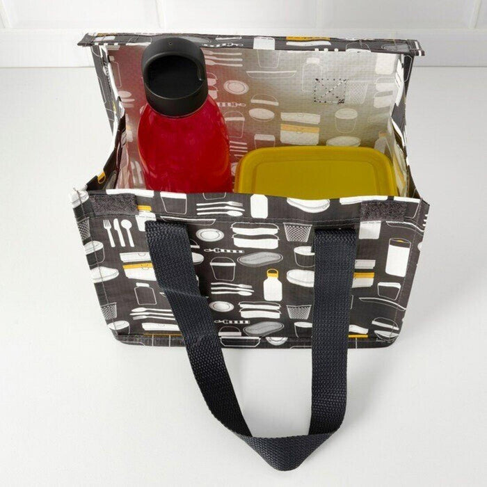 Reusable shopping bag with kitchen utensil pattern containing a red bottle and yellow container on a white background