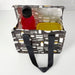 Reusable shopping bag with kitchen utensil pattern containing a red bottle and yellow container on a white background