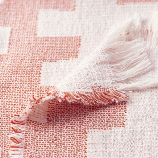 Close-up of SLÅNSPINNMAL Throw showcasing its classic elegance.