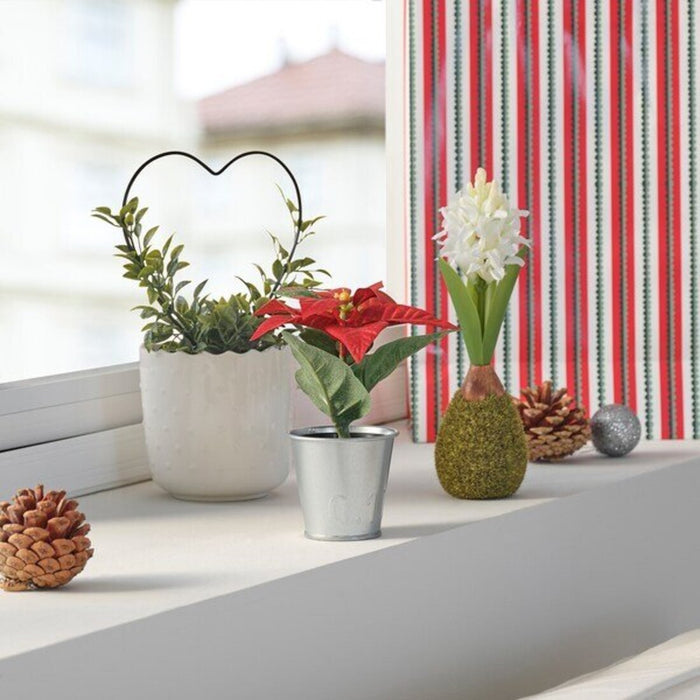 Digital Shoppy Bring the spirit of the season indoors or outdoors with the easy-to-care-for IKEA Artificial Potted Plant in Poinsettia Red, 6 cm