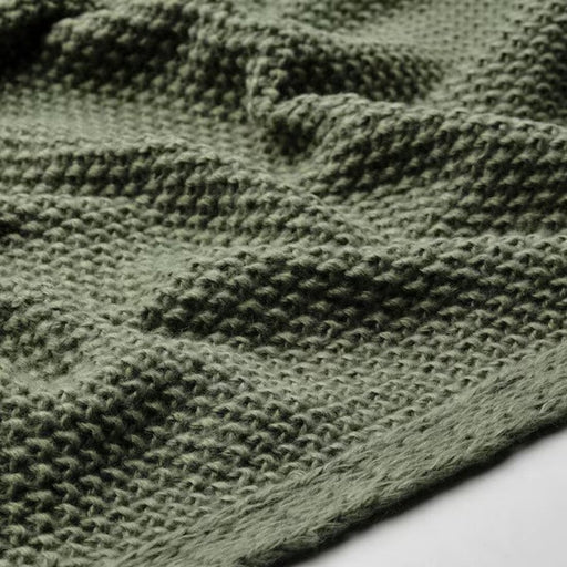 Close-up of the elegant grey-green texture of HUMLEMOTT throw, Soft and Warm Fabric Detail   40549554