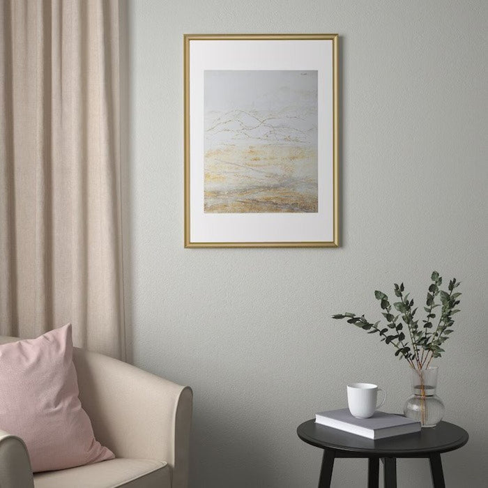 Gallery wall featuring IKEA SILVERHÖJDEN Frames with family photos and art prints