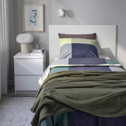 "Elegant dark grey-green bedspread from IKEA's TRATTVIVA collection."