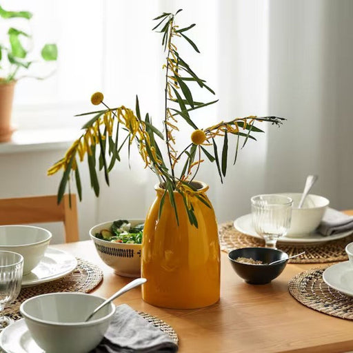 IKEA Vase: A striking yellow vase that adds a pop of color to any room.