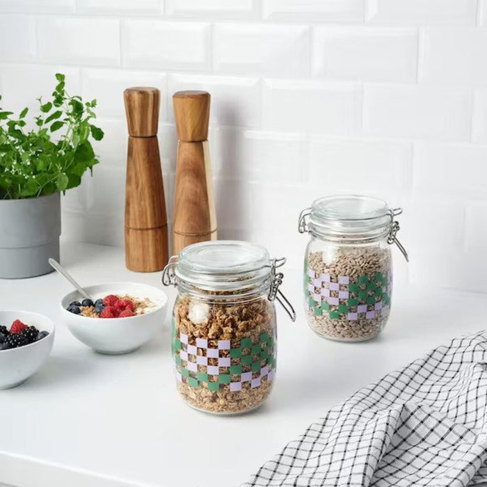 Digital Shoppy KORKEN jar in clear glass, 1 liter, featuring a lively green and lilac pattern, accompanied by a fitted lid  20553759