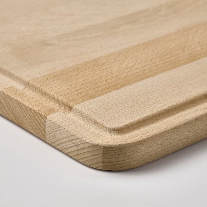 A chef's essential tool, an IKEA chopping board in a large size with a non-slip surface for safety.-80570671