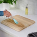 A handy and compact IKEA plastic chopping board with a built-in colander, ideal for rinsing fruits and vegetables-80570671