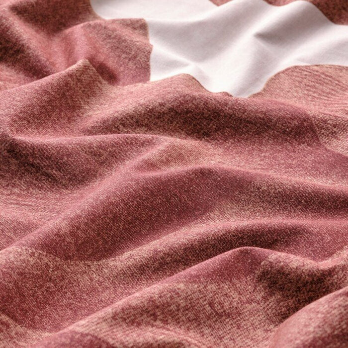 A detailed view ofduvet cover set with bold florals in shades of pink is made of a cotton/viscose blend that draws away moisture 70541028