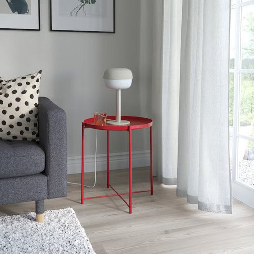 Red IKEA GLADOM Tray Table placed in an indoor setting, adding a vibrant touch to the room and providing a convenient surface for everyday use-60533651