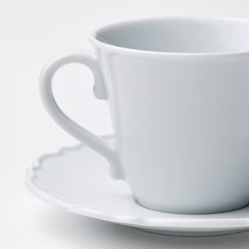 Close-up view of high-quality porcelain detailing on UPPLAGA Cup and Saucer 50560305