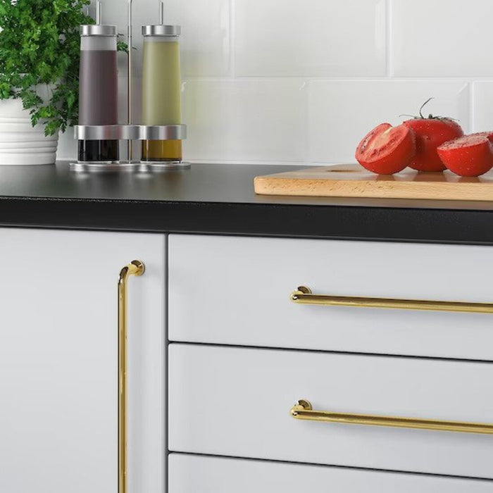  A modern touch for your cabinets – the BAGGANÄS handle in brass-color, measuring 335 mm, adds a stylish and functional element-60338428