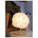 VINDKAST Table Lamp casting a warm and cozy glow in a modern living room-80539204