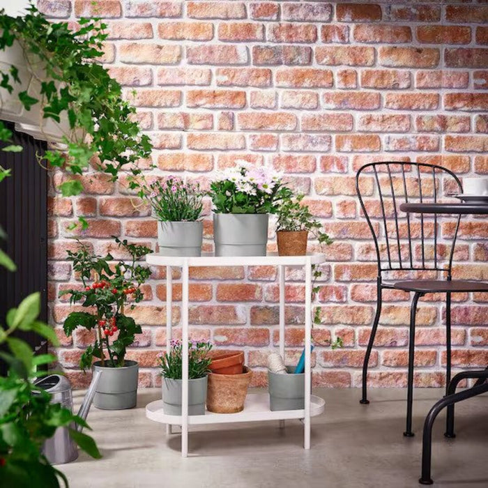 IKEA OLIVBLAD Plant Stand adding charm to an outdoor garden space – A durable and weather-resistant solution for displaying your favorite plants