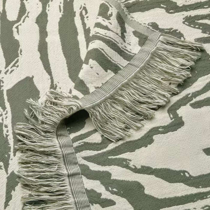 Close-up of the textured pattern on the IKEA TANDMOTT Throw, showcasing its modern design and tactile appea