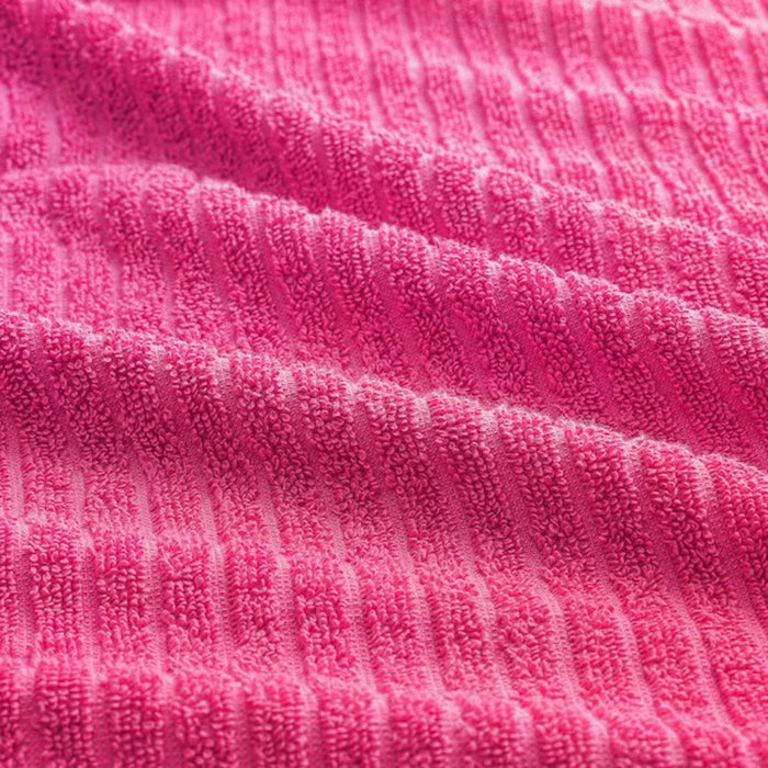 Close-up of IKEA VÅGSJÖN Bath Towel fabric texture, showcasing its quality and comfort in a stylish soft hue