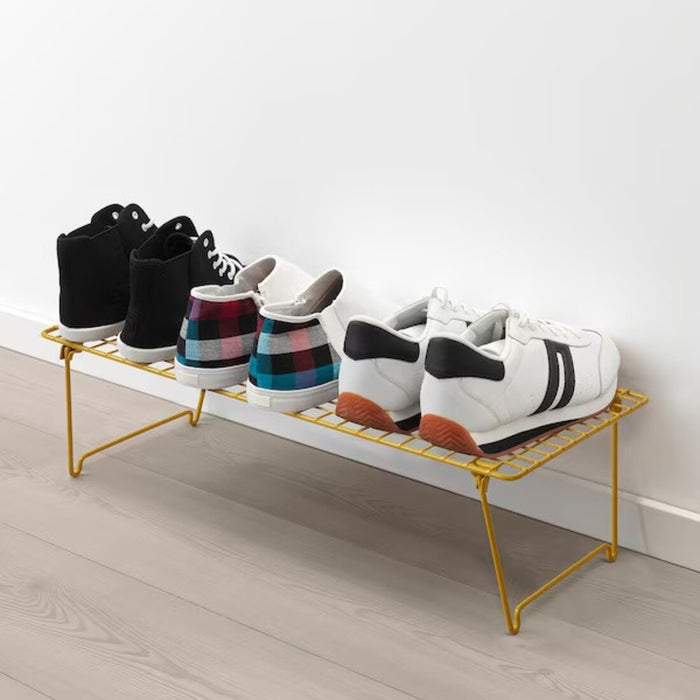  a photo showcasing neatly organized shoes on the rack, highlighting its functional purpose.