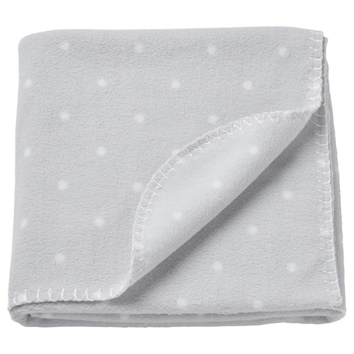 Light grey IKEA LEN blanket with white polka dots, measuring 70x90 cm (28x35 inches), featuring a folded corner and visible stitching along the edges-40496433