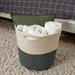 an image highlighting A spacious basket for storing throws, cushions, clothes, and other things that you use often and want close at hand yet still hidden.
