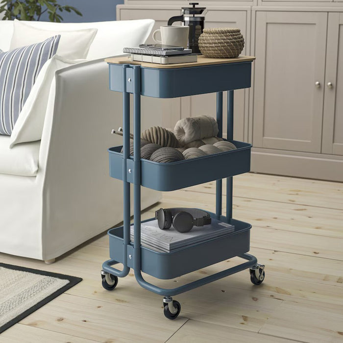 The IKEA RÅSKOG Trolley in grey-blue, measuring 35x45x77 cm, is a versatile storage cart perfect for organizing supplies, tools, or pantry items.40586787