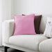 IKEA cushion covers in different colors and designs on a sofa