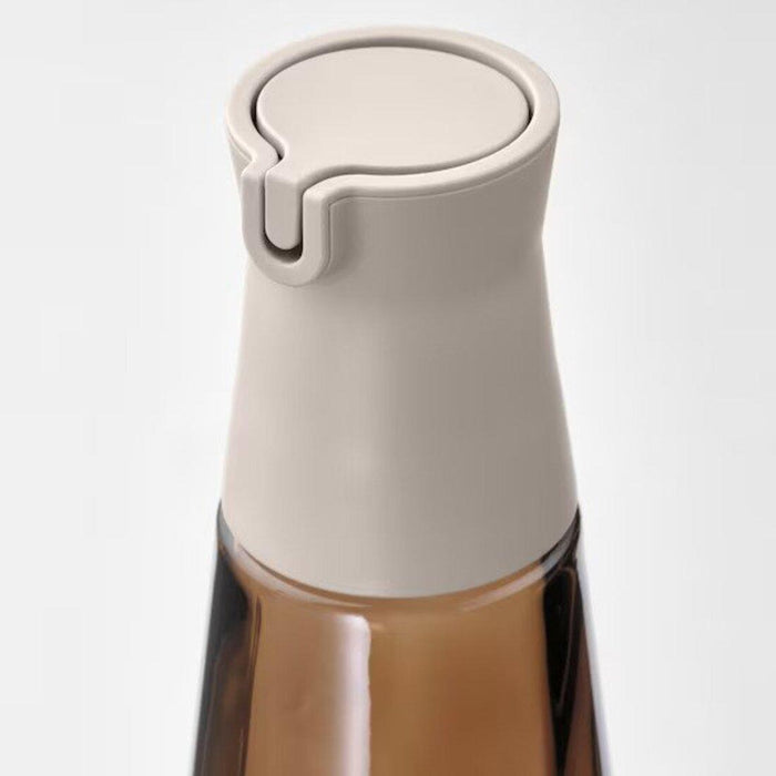 Brown glass bottle for storing and serving beverages 80523463