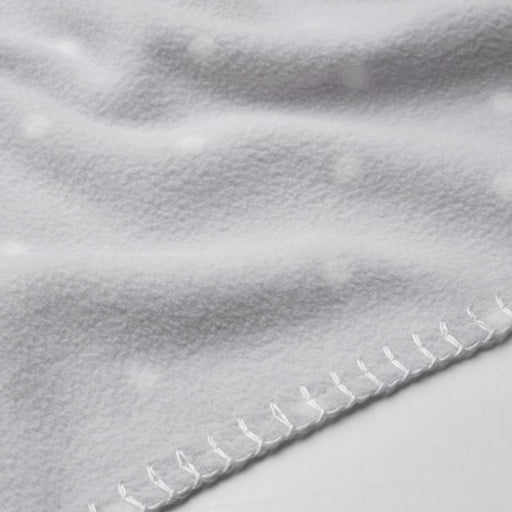 Close-up of a soft, white IKEA LEN blanket with a textured surface and raised dot pattern. Features neatly stitched edges for a durable and cozy feel.-40496433