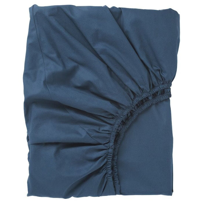 High-quality stitching and fabric of the dark blue fitted sheet from IKEA ULLVIDE. 90342725