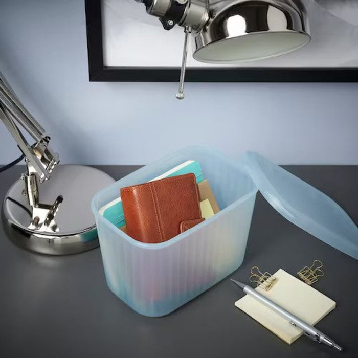 Transparent storage box with compartments, ideal for efficient organization of office supplies and documents.