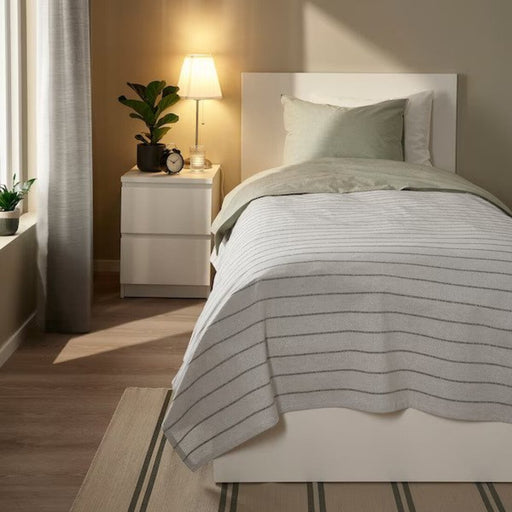 Scandinavian-inspired grey bedspread by IKEA, adding elegance to any room