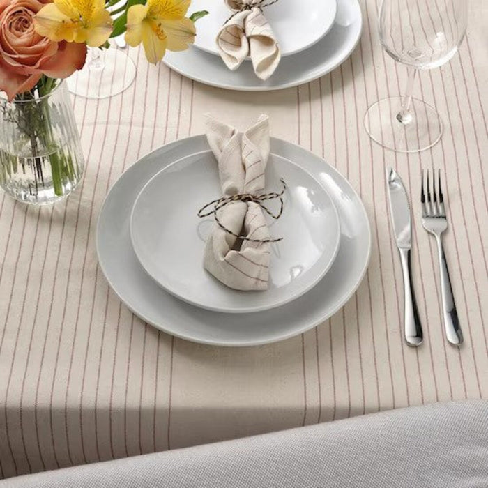 A 30x30 cm dining accessory with a classic striped pattern in red and natural colors.-60559189