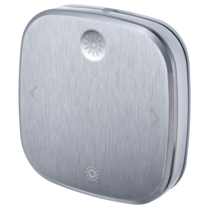 IKEA STYRBAR smart remote control in stainless steel finish. Designed for wireless operation of IKEA smart lighting, featuring intuitive buttons for brightness, color temperature, and power control-90493984 