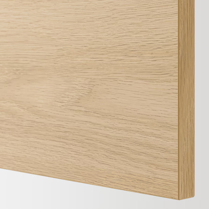 Close-up of a wooden panel with a light oak finish, showcasing a smooth surface and natural horizontal wood grain patterns. The panel's edge highlights its thickness and quality-40481554