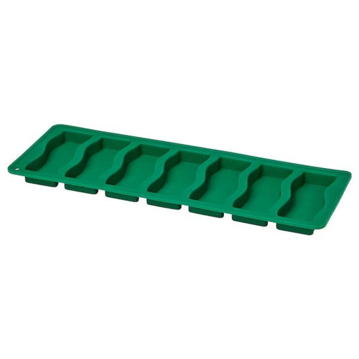 A vibrant green IKEA TABBERAS Green Baking Mould in a well-lit kitchen.-80552002